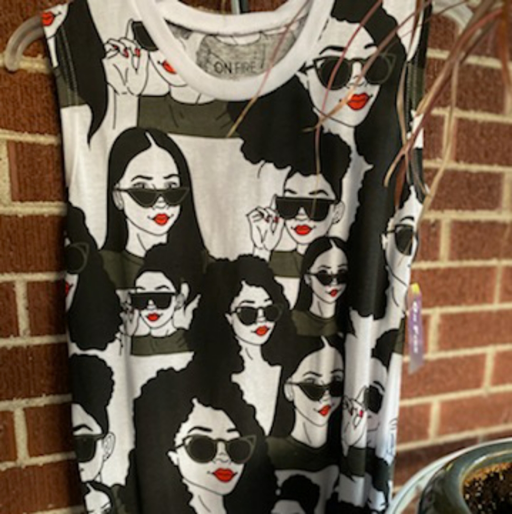 Sleeveless girl power fringed shirt.